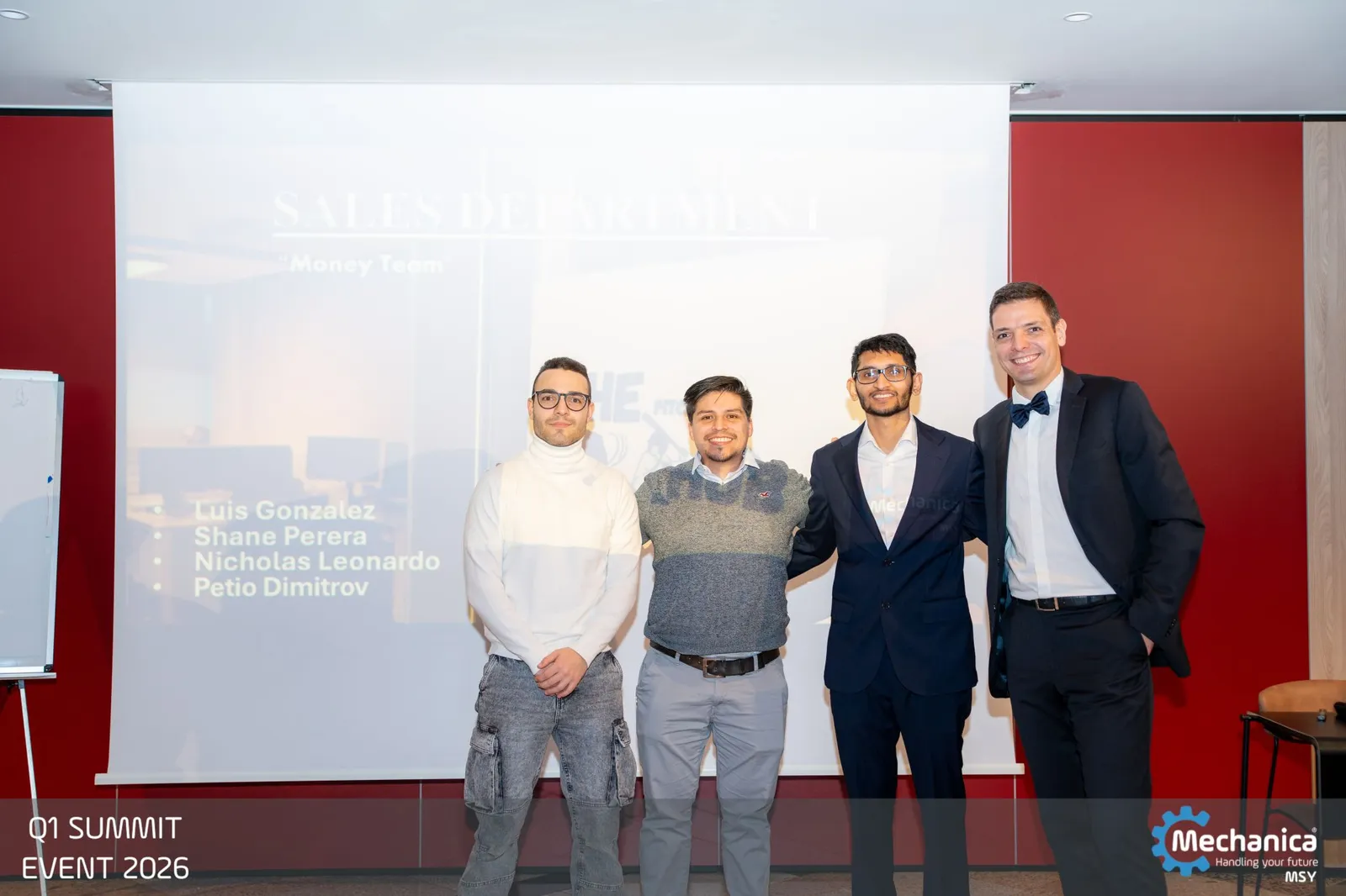 The sales department presenting in front of the screen