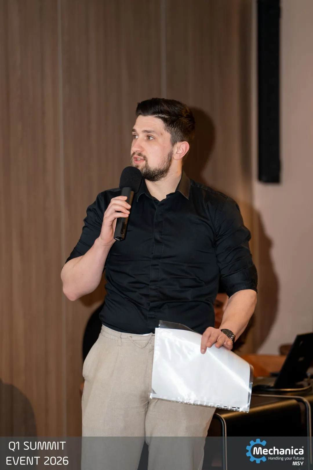 Colleague speaking on the microphone