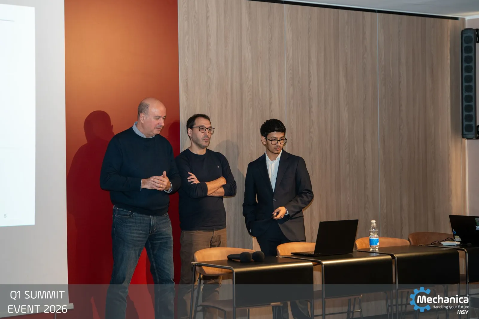 Colleagues at the laptop preparing to present