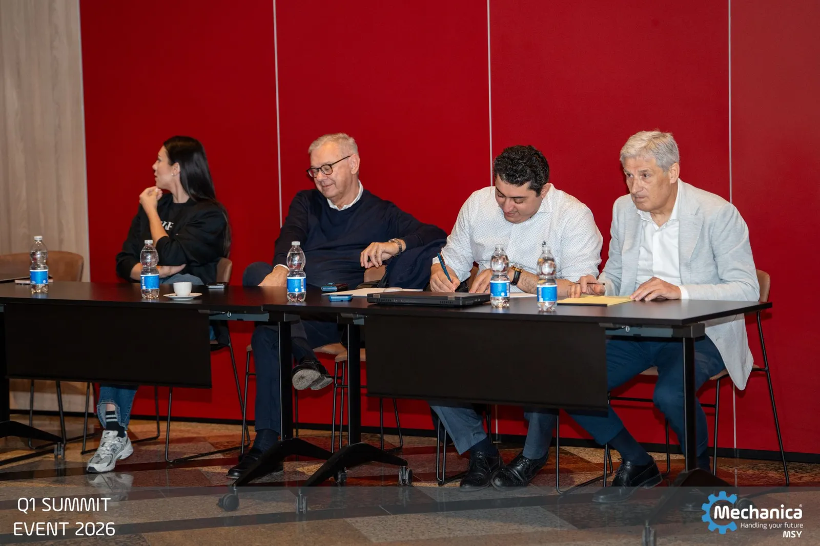 The jury table taking notes during the presentations