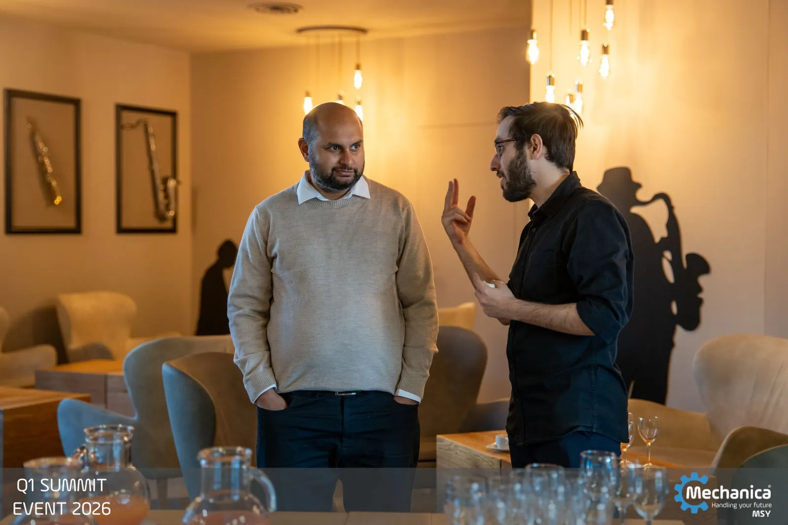 Two colleagues in conversation in the lounge
